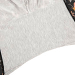 Close-up of a textured gray gusset fabric on a white background