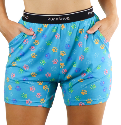 blue lounge shorts with colourful paw print, with Pure Snug signature logo on the waistband, and two large pockets