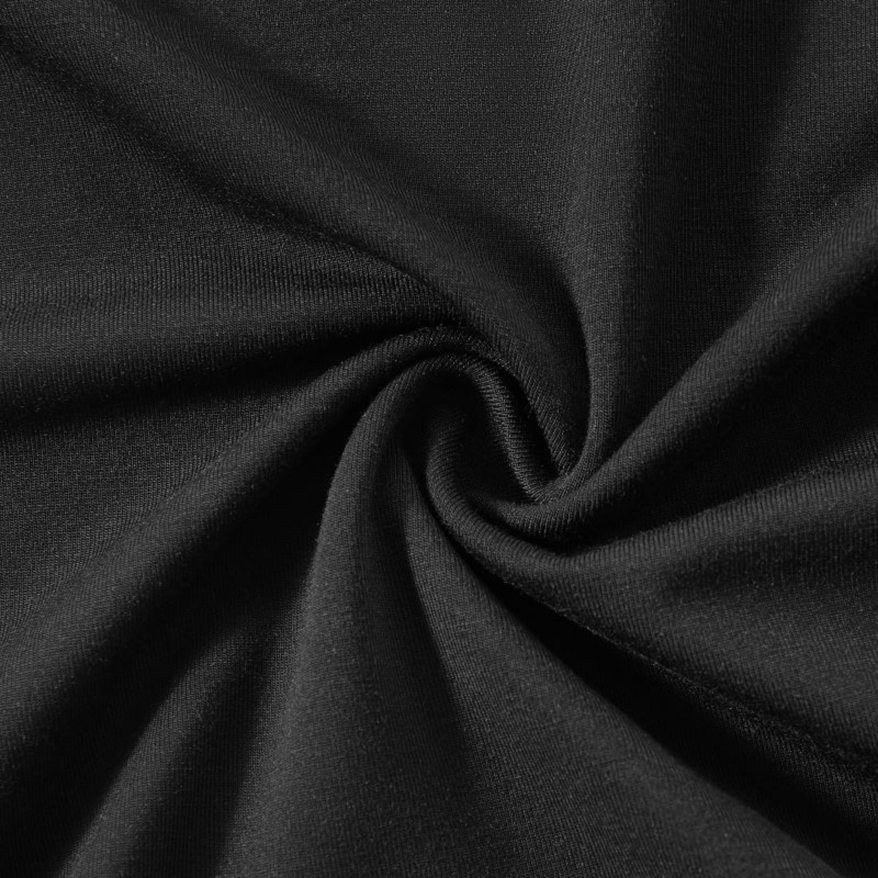 Close-up of black fabric with folds