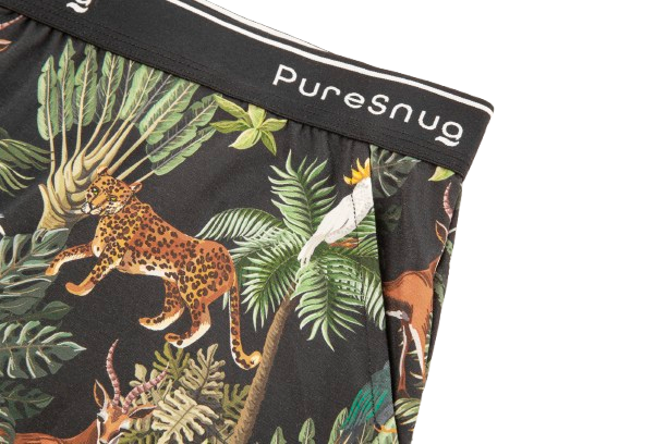 Close-up of women's lounge short in a vibrant jungle print with animals and foliage, topped with a black PureSnug waistband.