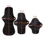 Three black reusable menstrual pads of varying sizes: 36 cm, 27 cm, and 20 cm, marked with dimensions in orange text.