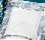 Close-up of PureSnug gusset interior with soft white lining, surrounded by blue floral fabric.