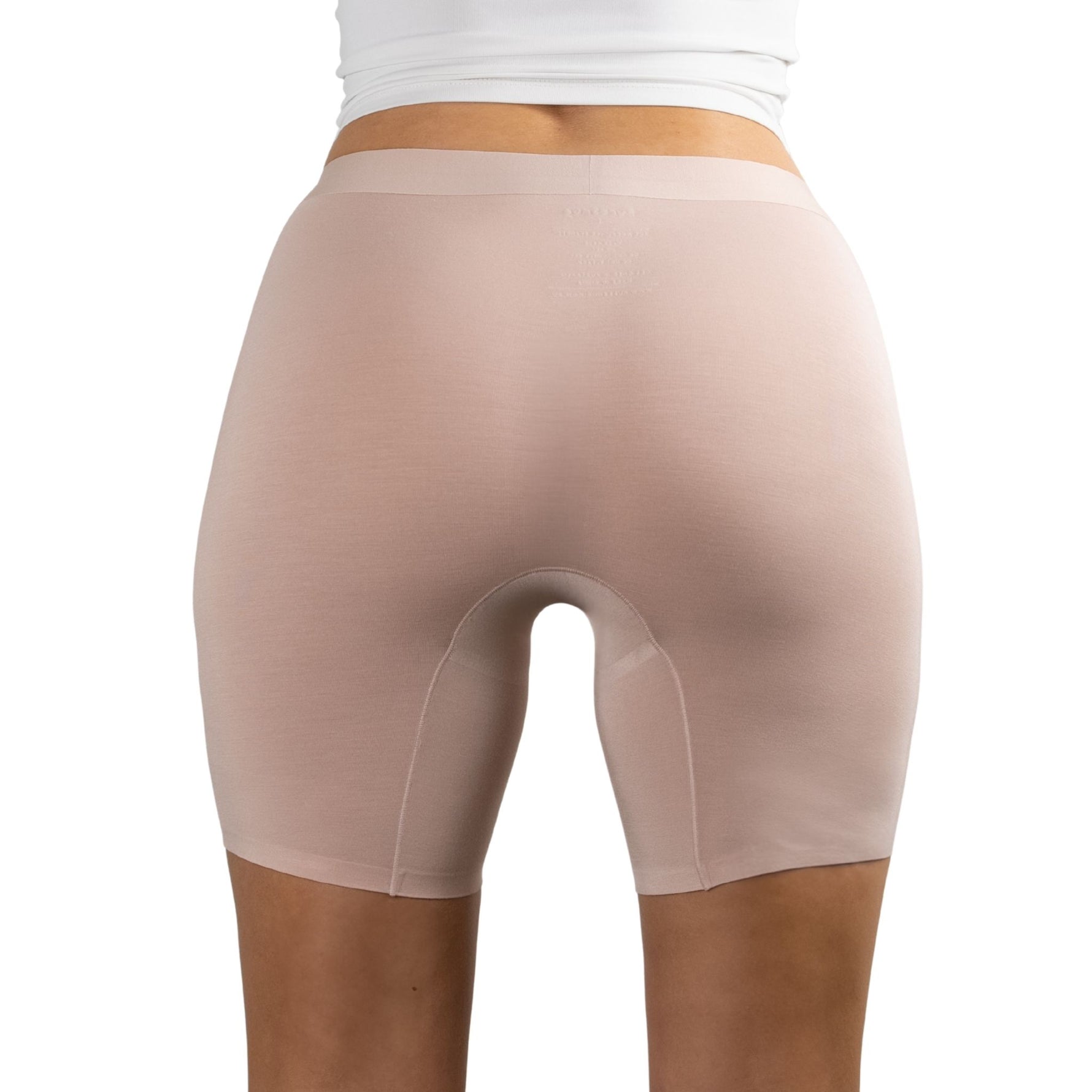 Back view of PureSnug Blush Beige boxer shorts worn by a person on a white background