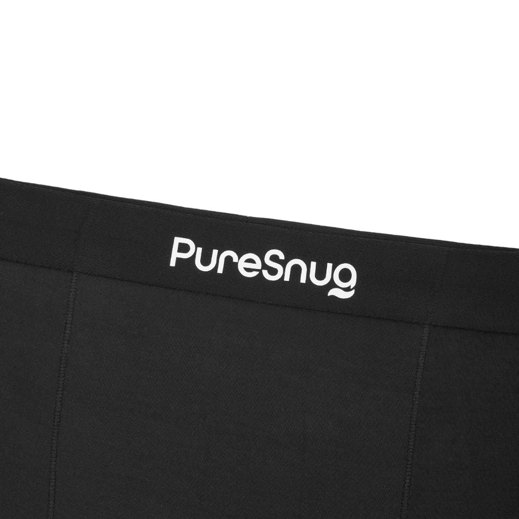 Close-up of a black waistband with the “PureSnug” logo in white, highlighting the sleek and comfortable design of our men’s underwear.