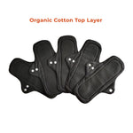 A set of 5 black reusable day pads, fanned out against a white background. Text above reads "Organic Cotton Top Layer," indicating eco-friendly material.