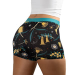 Close-up of woman wearing PureSnug Golden Snug floral-patterned boyshorts with colorful print