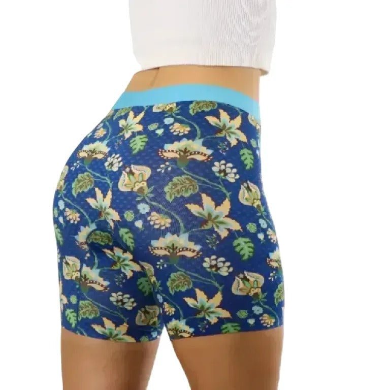 PureSnug blue floral shorts with light blue waistband, green leaves, and flower motifs on white background.