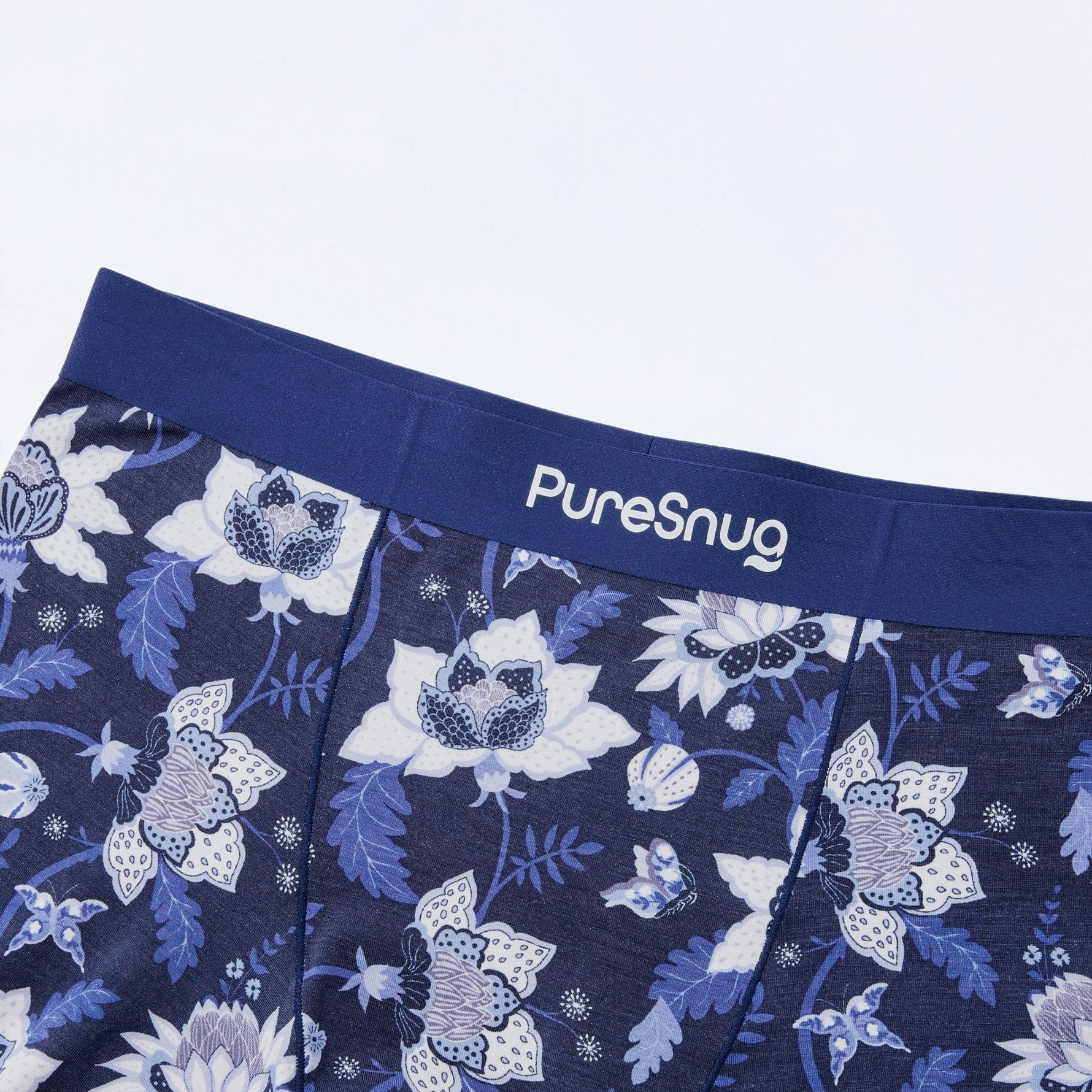 Floral patterned underwear with 'PureSnug' branding on a white background