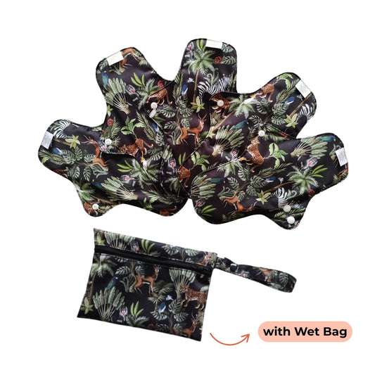 Set of PureSnug's Reusable day pads with colorful jungle print, featuring deer and foliage. Arranged in a fan shape, accompanied by a matching wet bag.