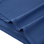 Close-up of the hem on PureSnug navy lounge shorts, showing smooth modal fabric with neat stitching and naturally soft crease