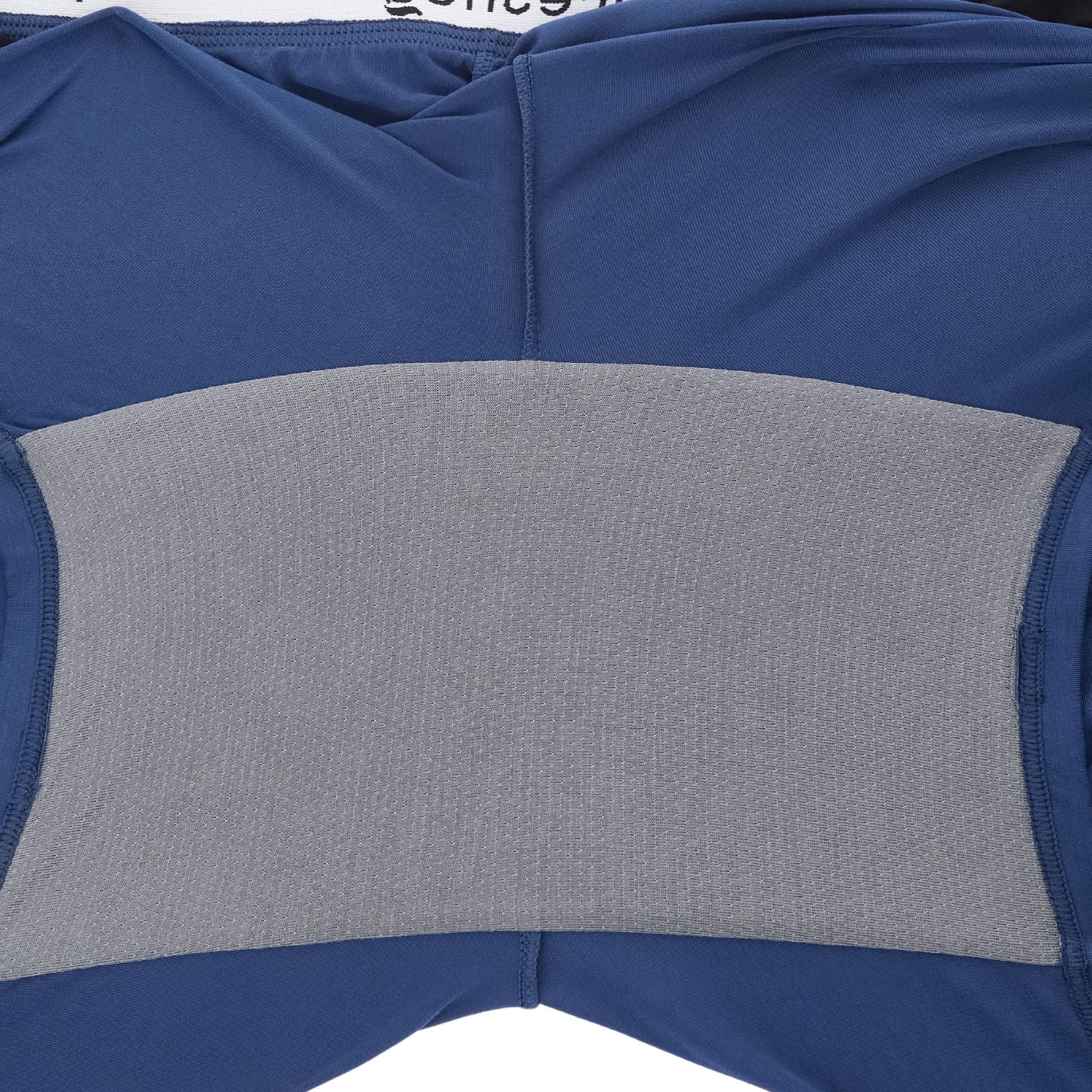 Close-up of PureSnug navy blue lounge short featuring a gray gusset panel at the back center