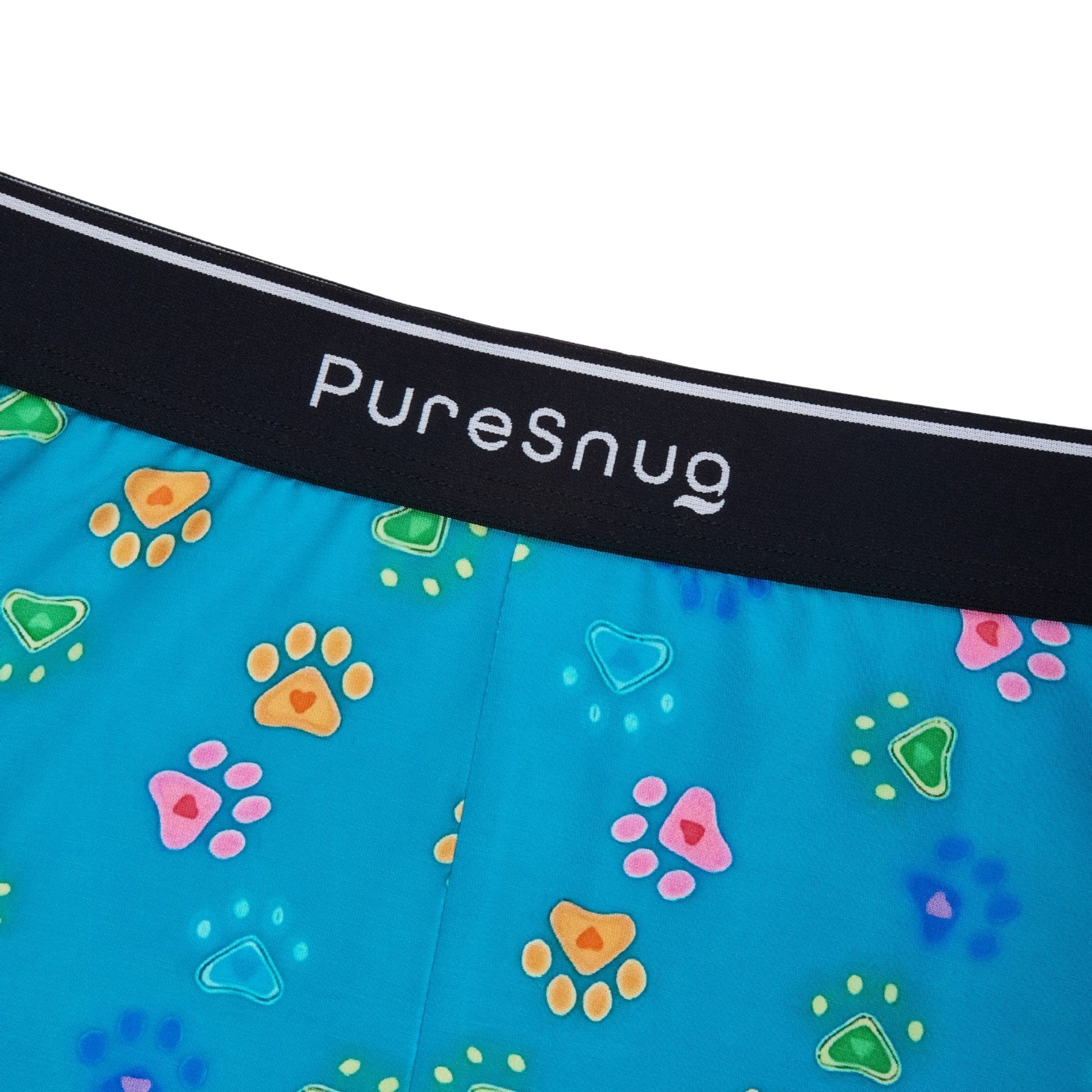 PureSnug lounge short with a black logo waistband, made from soft blue fabric decorated with multicolored paw prints