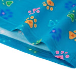 Close-up of the hem on PureSnug’s “Pawfect” lounge shorts, showcasing bright blue fabric with colorful paw prints