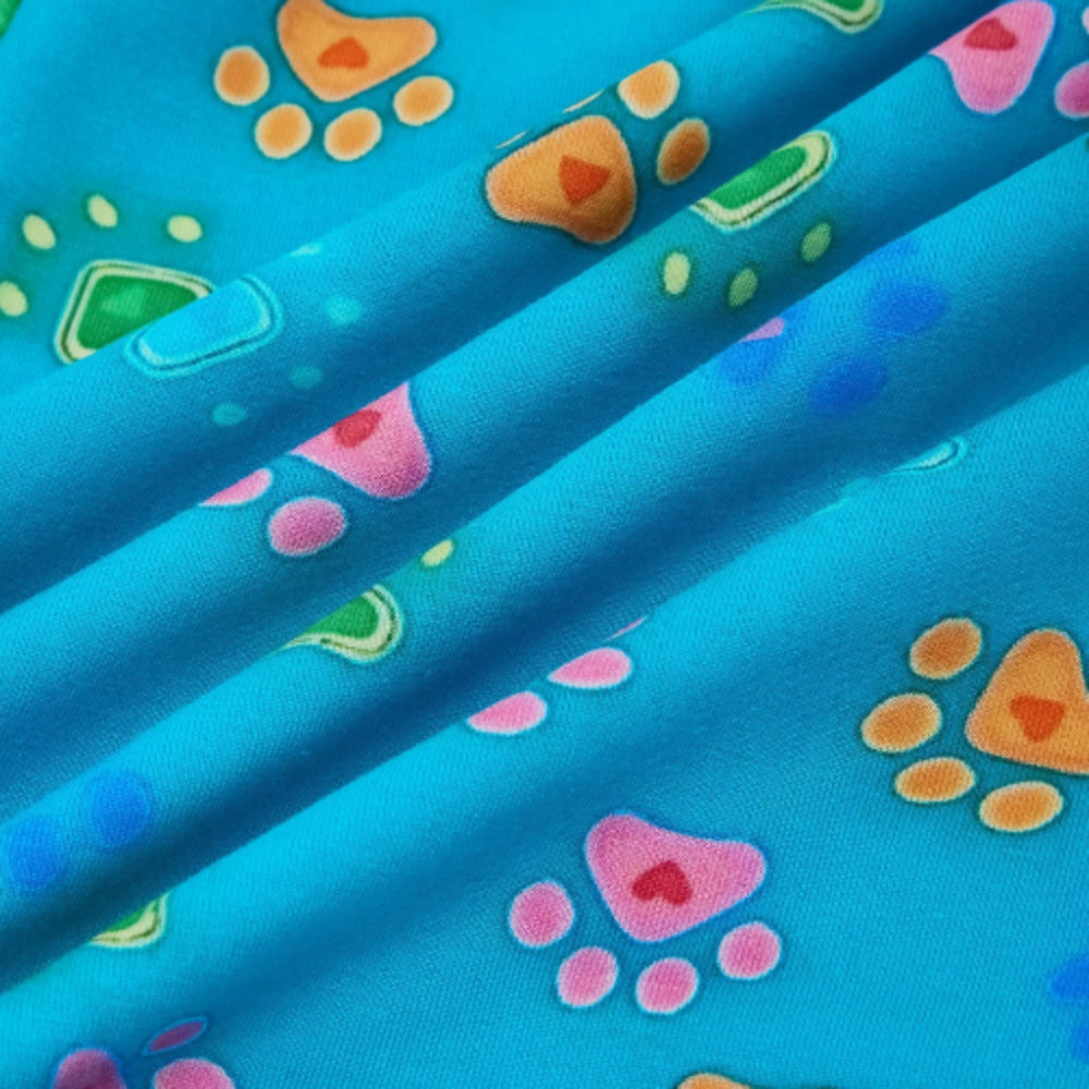 PureSnug’s “Pawfect” lounge short fabric in bright blue with overlapping folds that highlight its soft texture and vibrant hues.