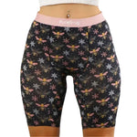 PureSnug Bees 8" biker shorts with pink waistband, bee & snowflake print, paired with white midriff top.