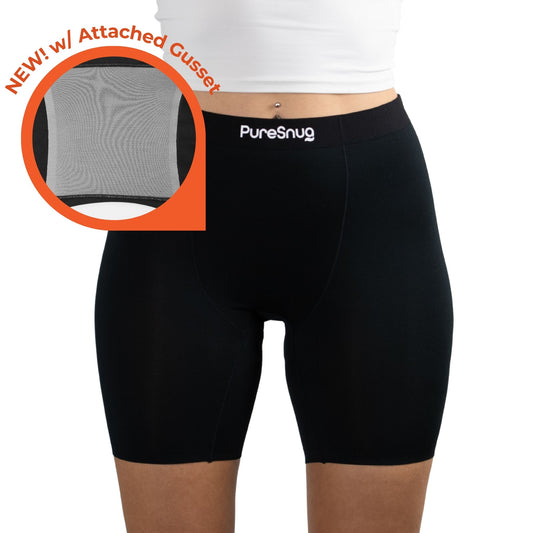 Model wearing PureSnug's new black high-waisted boxer brief featuring a new attached gusset, highlighted by an orange circle with text.