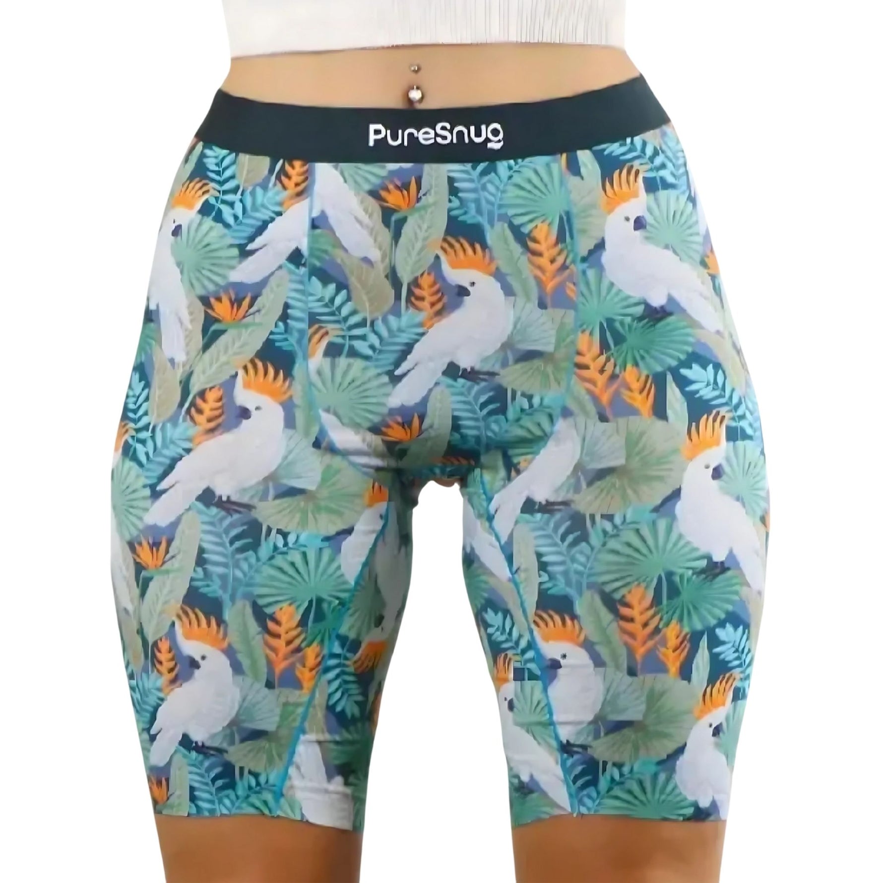 Close-up of high-waisted biker shorts with a tropical cockatoo print, green leaves, and a playful, bold vibe.