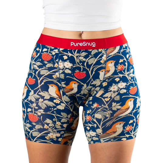 berry and bird patterned women's boxer shorts in navy blue background, with red waistband and 'PureSnug' branding 