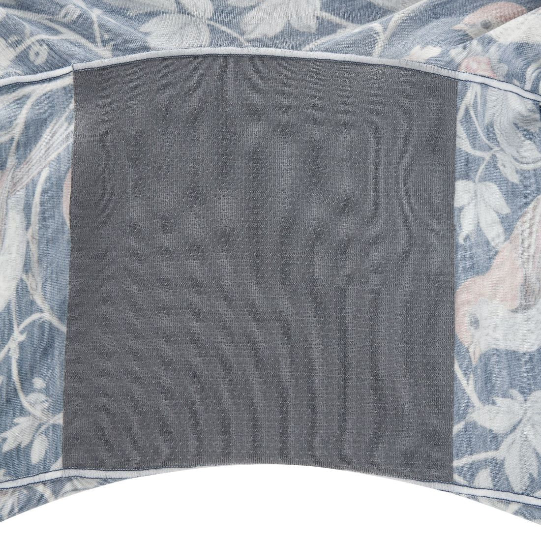 Gray gusset square on a floral patterned fabric background